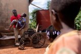 PHOTO ESSAY: In Uganda, a sprawling generation of children finds its fate entwined with elders