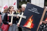 Women's rights activists rally in Belgium fearing US plans for birth control supplies