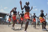 Fusion between culture and modernity as children dance in Kenya’s refugee camp