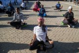 Yoga in a Zimbabwe tavern is the latest mental health outreach in a struggling country